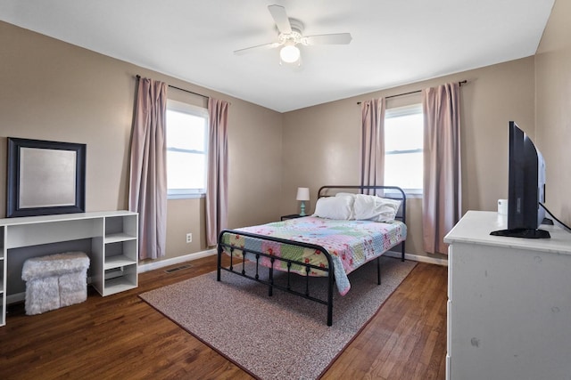 bedroom with dark wood-type flooring and ceiling fan