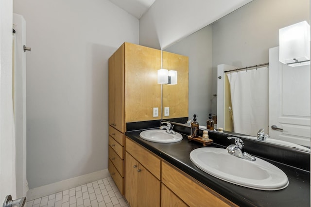 bathroom with vanity and tile patterned flooring