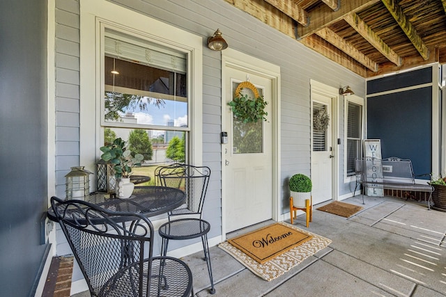 doorway to property featuring a porch