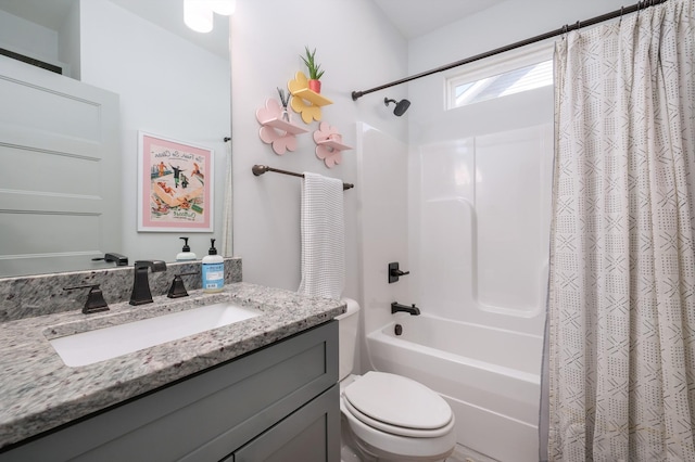 full bathroom with vanity, toilet, and shower / bath combo with shower curtain