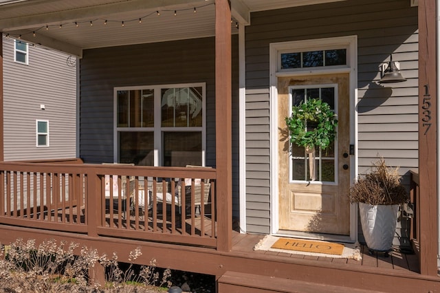 entrance to property featuring covered porch