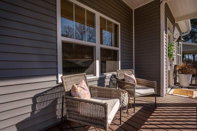 wooden terrace featuring an outdoor hangout area