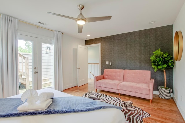 bedroom with ceiling fan, access to exterior, light hardwood / wood-style floors, and french doors