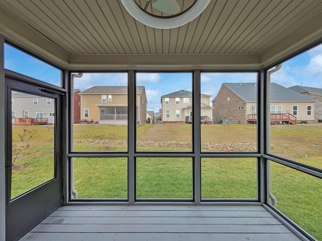 unfurnished sunroom featuring wooden ceiling