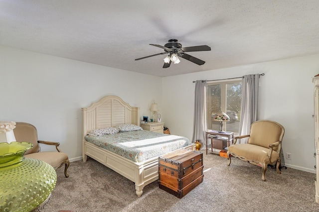 bedroom featuring ceiling fan, carpet flooring, and a textured ceiling