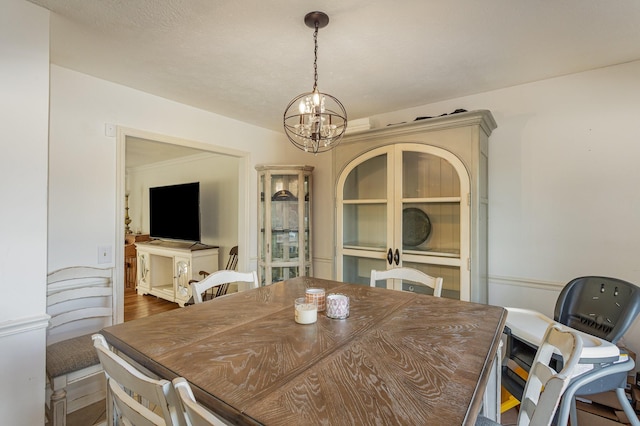 dining area featuring a chandelier