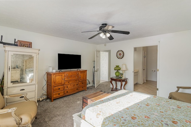 carpeted bedroom with a textured ceiling and ceiling fan