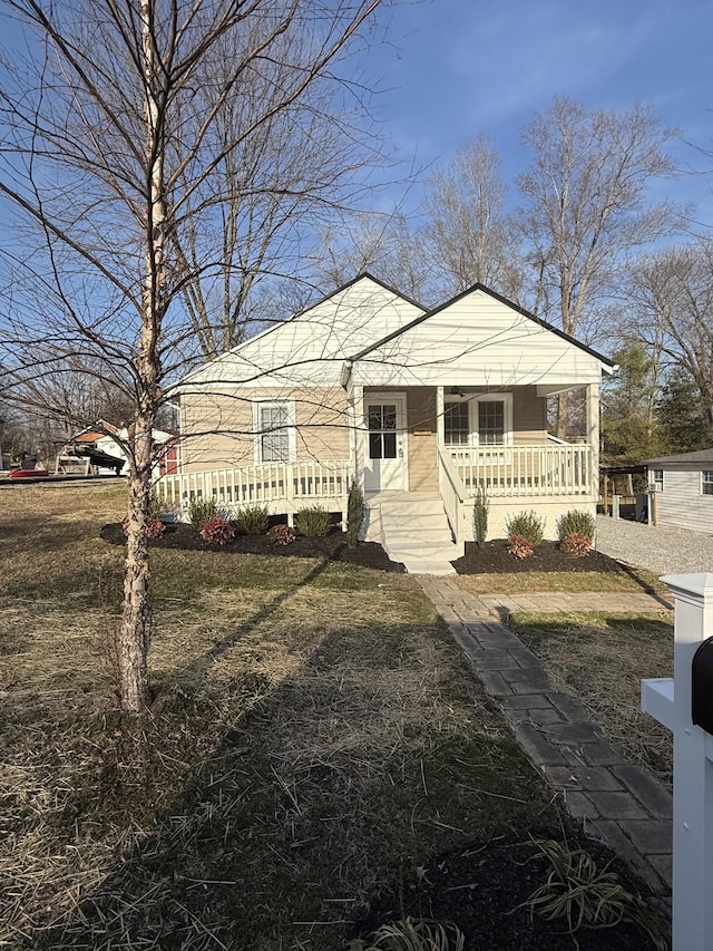 view of front of home featuring a porch and a front yard