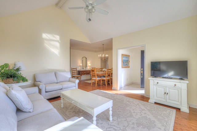 living room featuring beamed ceiling, high vaulted ceiling, ceiling fan with notable chandelier, and light hardwood / wood-style flooring