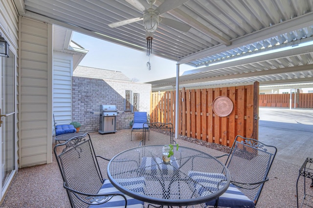 view of patio with area for grilling and ceiling fan