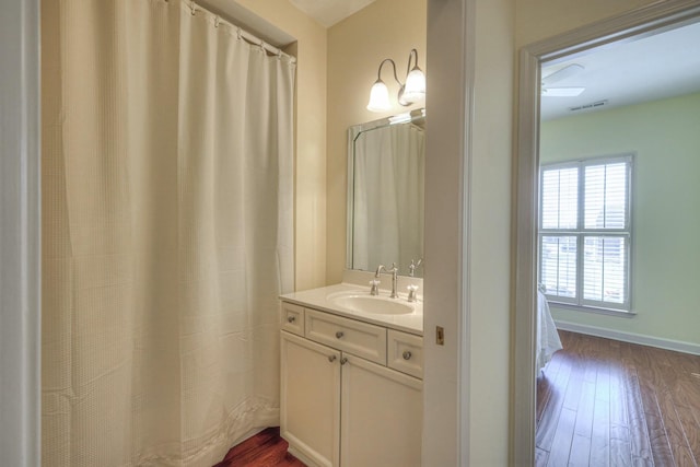 bathroom with vanity and wood-type flooring