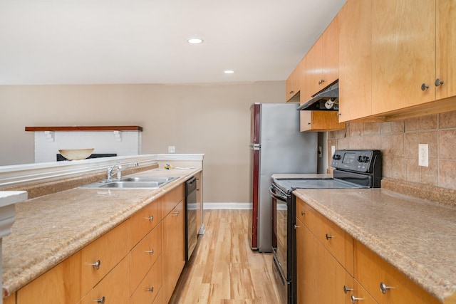 kitchen with sink, backsplash, light hardwood / wood-style flooring, and black appliances