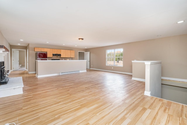 unfurnished living room featuring light hardwood / wood-style flooring