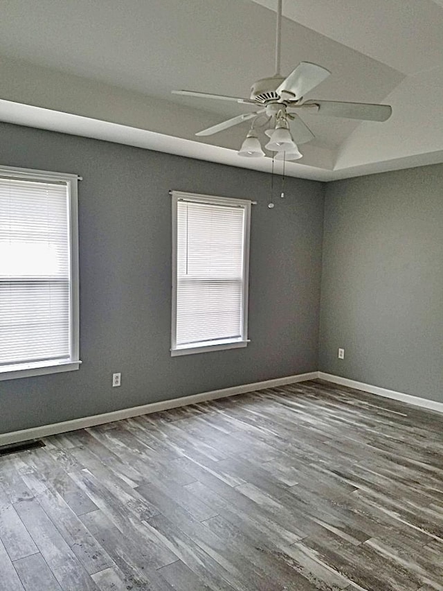 empty room with hardwood / wood-style flooring and ceiling fan