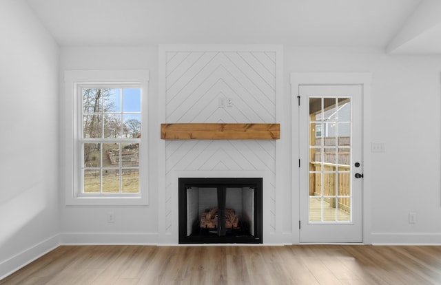 unfurnished living room featuring light hardwood / wood-style floors