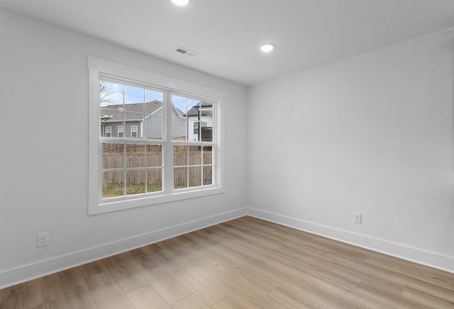 unfurnished room featuring light wood-type flooring