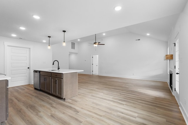 kitchen featuring pendant lighting, dishwasher, a kitchen island with sink, dark brown cabinets, and light hardwood / wood-style flooring