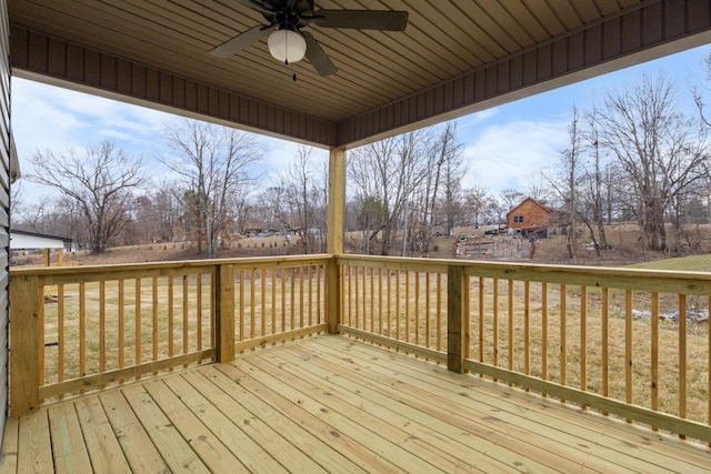 wooden terrace featuring ceiling fan