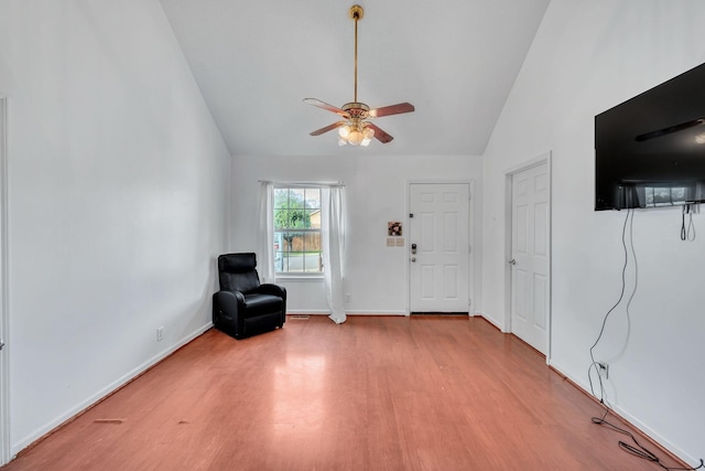 unfurnished room with ceiling fan, lofted ceiling, and light hardwood / wood-style floors