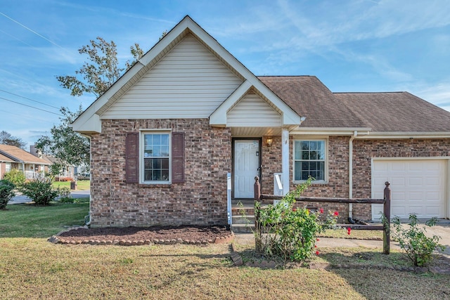 view of front of house with a garage and a front lawn