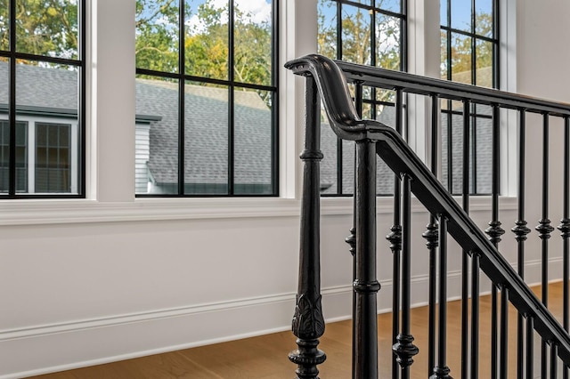 stairway featuring hardwood / wood-style flooring