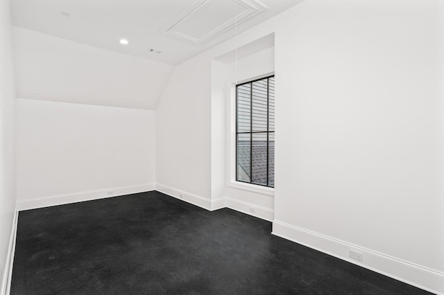 additional living space featuring vaulted ceiling