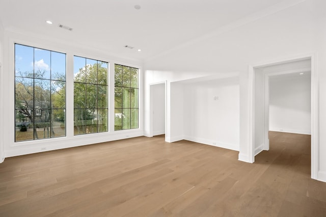 unfurnished room with wood-type flooring