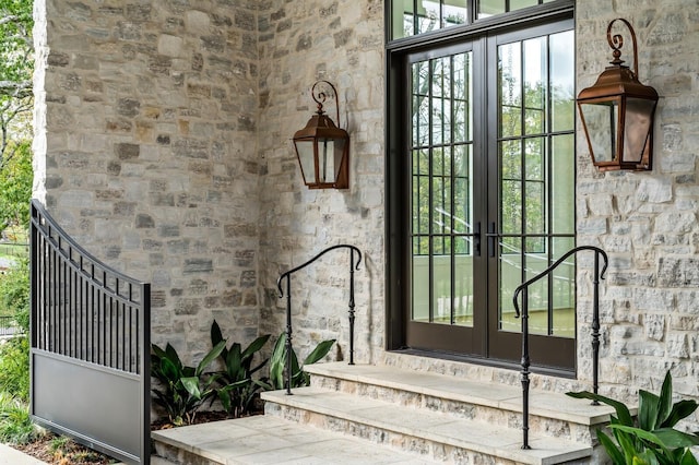 view of exterior entry featuring french doors