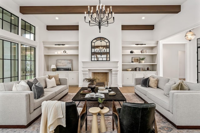 living room with an inviting chandelier, hardwood / wood-style floors, built in features, and beamed ceiling