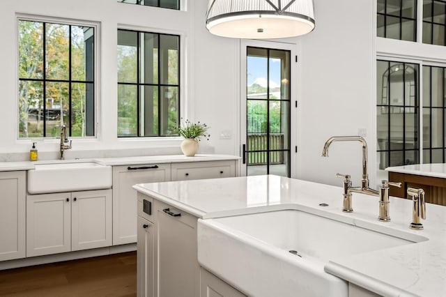 washroom with dark hardwood / wood-style floors and sink