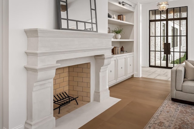 interior space with built in features and light wood-type flooring