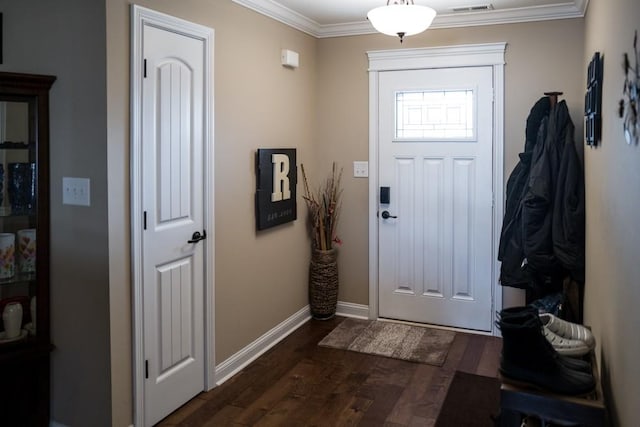 foyer entrance with crown molding and dark hardwood / wood-style flooring