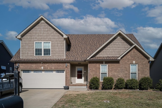 view of front of property with a garage and a front yard