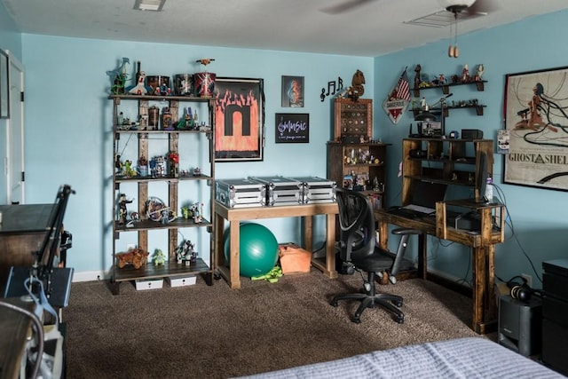 carpeted home office featuring ceiling fan