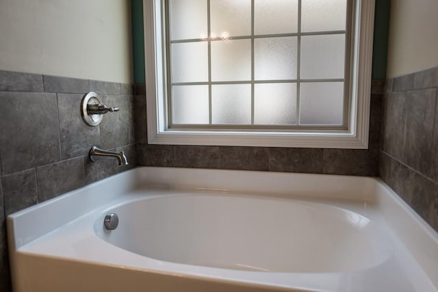 bathroom featuring a tub