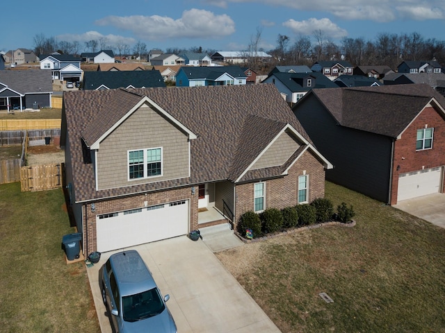 view of front of house featuring a garage and a front yard