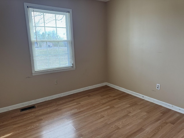 spare room with light wood-type flooring