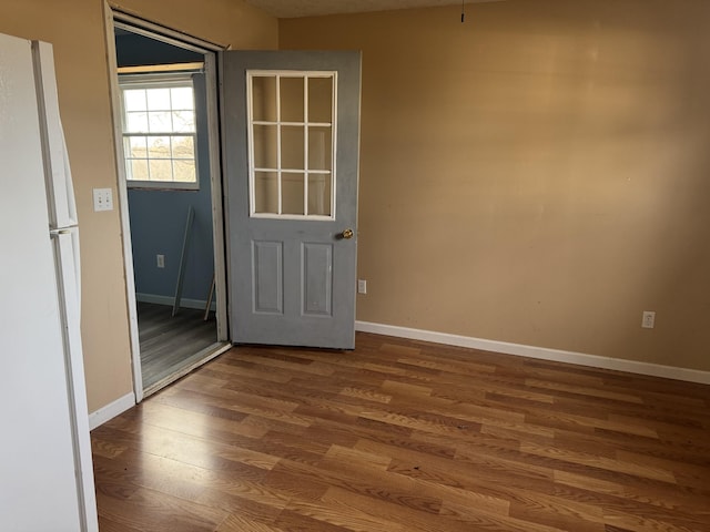 unfurnished room featuring wood-type flooring