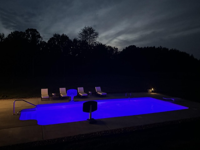 view of pool at night