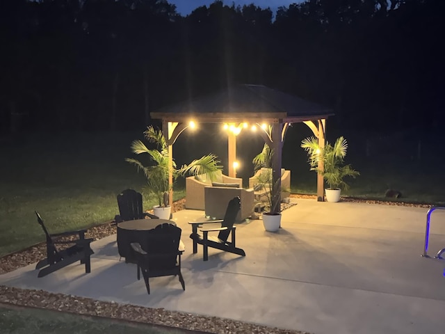 patio at twilight with a gazebo and an outdoor hangout area