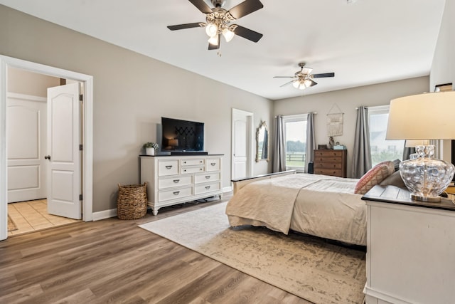 bedroom featuring ceiling fan and light hardwood / wood-style floors