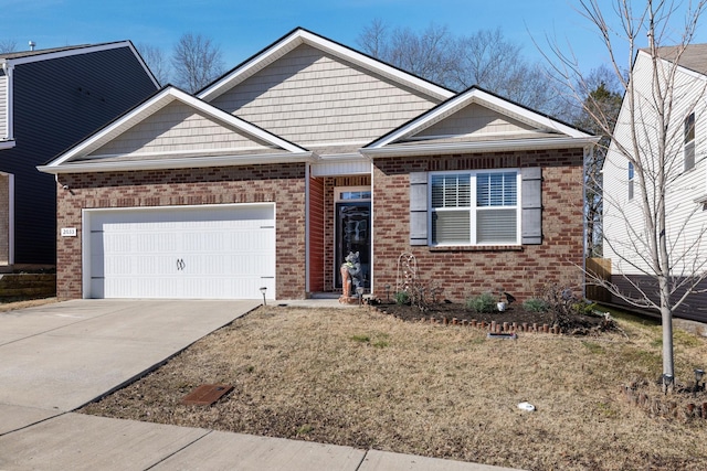 view of front of home featuring a garage and a front yard