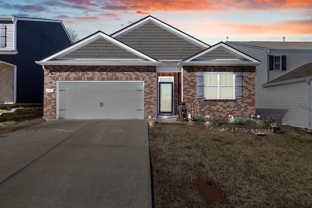 view of front facade featuring a garage and a lawn