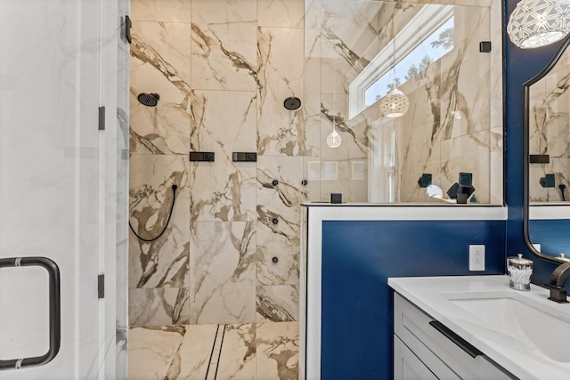 bathroom with vanity and a shower with door