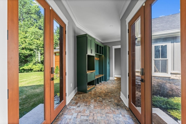 doorway with crown molding and french doors