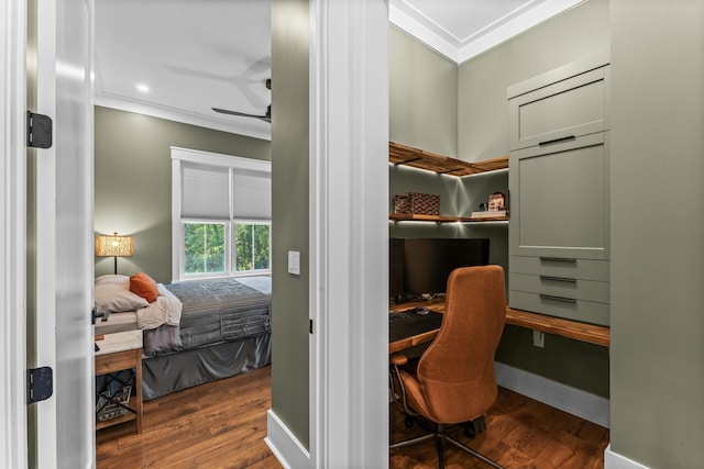 bedroom featuring ornamental molding and dark hardwood / wood-style flooring