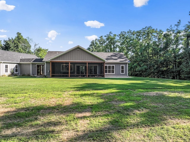 rear view of property with a yard