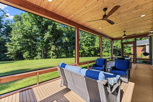 deck featuring an outdoor living space, a lawn, and ceiling fan