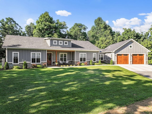 view of front of home featuring a garage and a front lawn