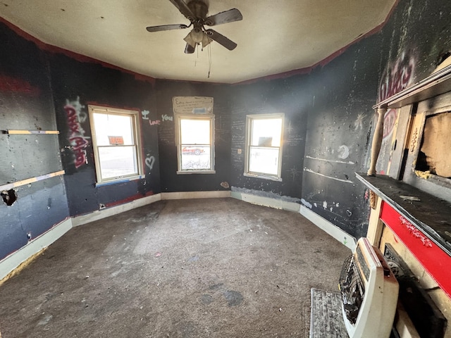 interior space featuring ceiling fan and heating unit